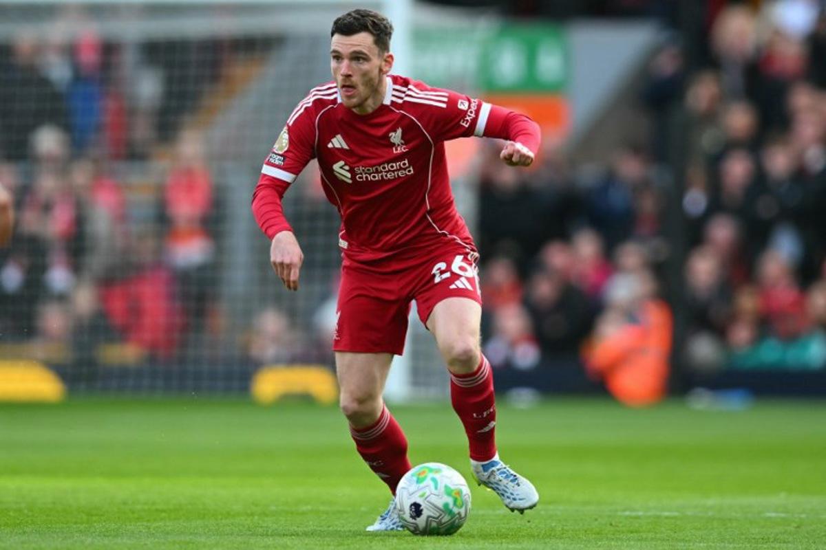 Liverpool's Scottish defender #26 Andrew Robertson looks to play a pass during the English Premier League football match between Liverpool and Fulham at Anfield in Liverpool, north west England on April 11, 2026.  ANDY BUCHANAN / AFP
