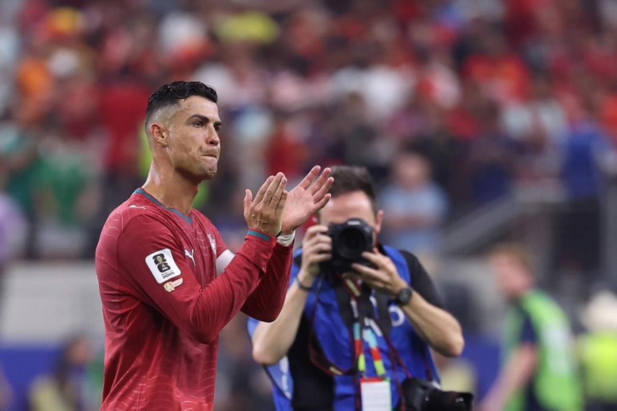 Portugal's forward #07 Cristiano Ronaldo greets fans after losing the 2026 World Cup round of 16 football match between Portugal and Spain at the Dallas Stadium in Arlington on July 6, 2026.  Thomas COEX / AFP