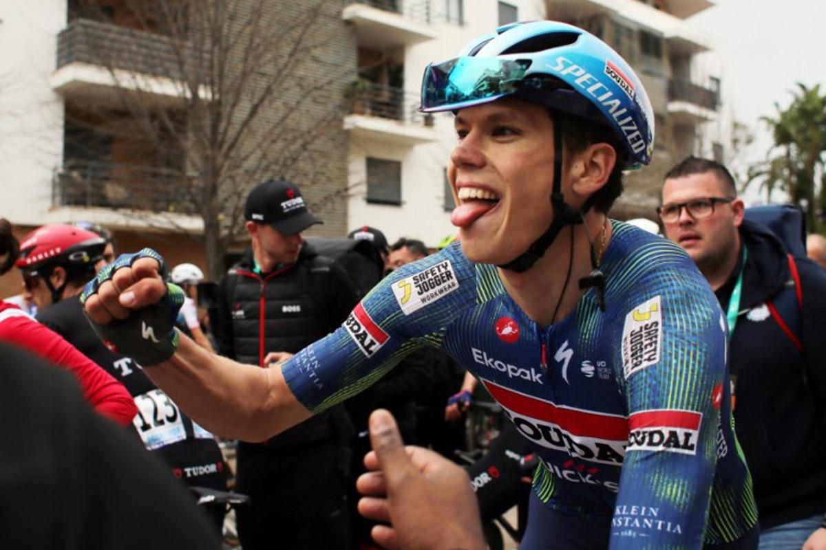 Soudal Quick-Step French cyclist Paul Magnier celebrates winning the first stage of the 52nd edition of the Volta ao Algarve, a 183.5 km race between Vila Real de Santo Antonio and Tavira, on February 18, 2026.  João Matos / AFP