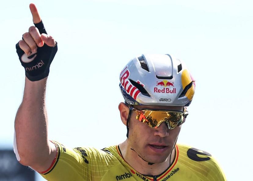 Team Visma | Lease a Bike's Belgian rider Wout Van Aert celebrates crossing the finish line to win the 5th stage of the Tour Auvergne-Rhone-Alpes cycling race (formerly known as the Criterium du Dauphine), 195,8km between Saint-Chamond and Villars-les-Dombes, central France, on June 11, 2026.  Anne-Christine POUJOULAT / AFP