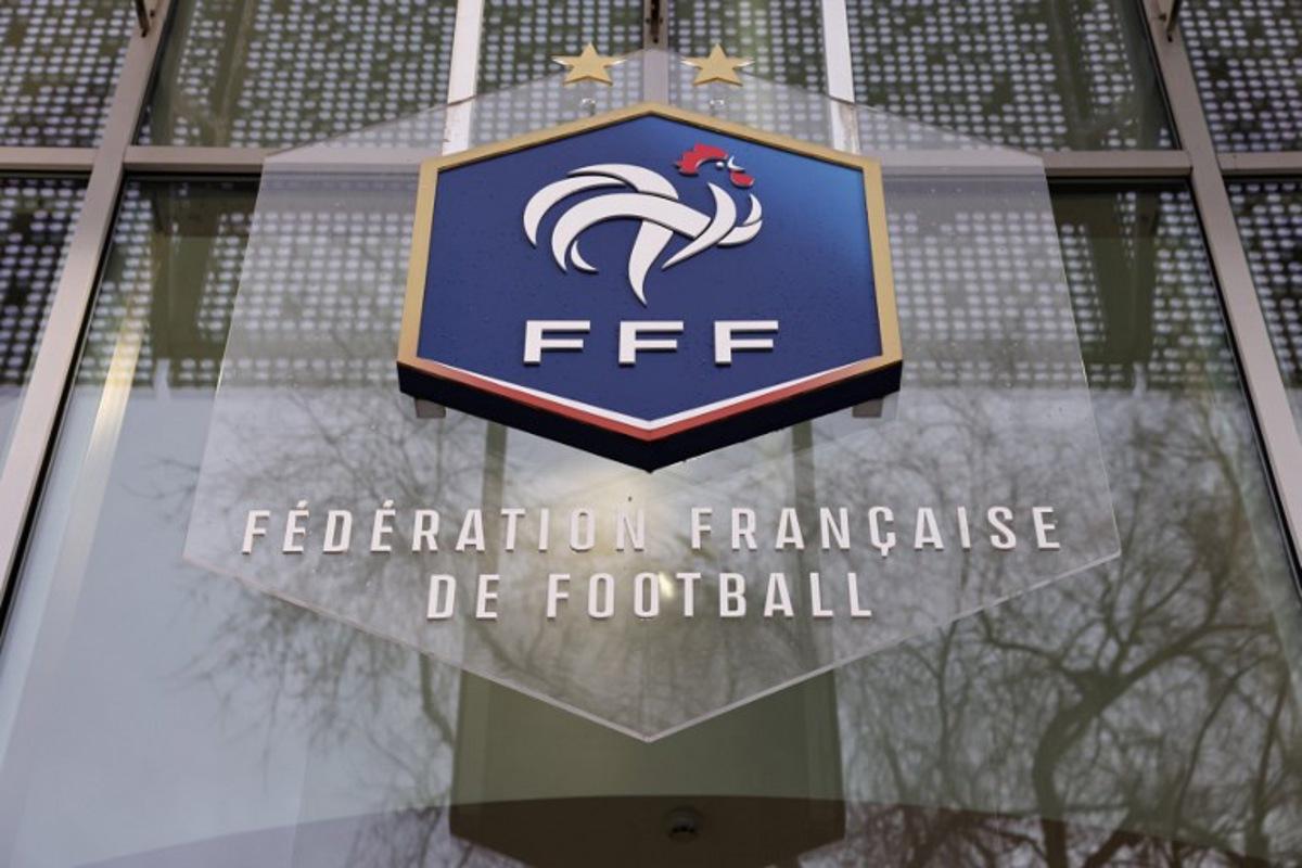 A picture taken on January 11, 2023 shows the logo of the French Football Federation (FFF) on the facade of its headquarters in Paris.  Thomas SAMSON / AFP