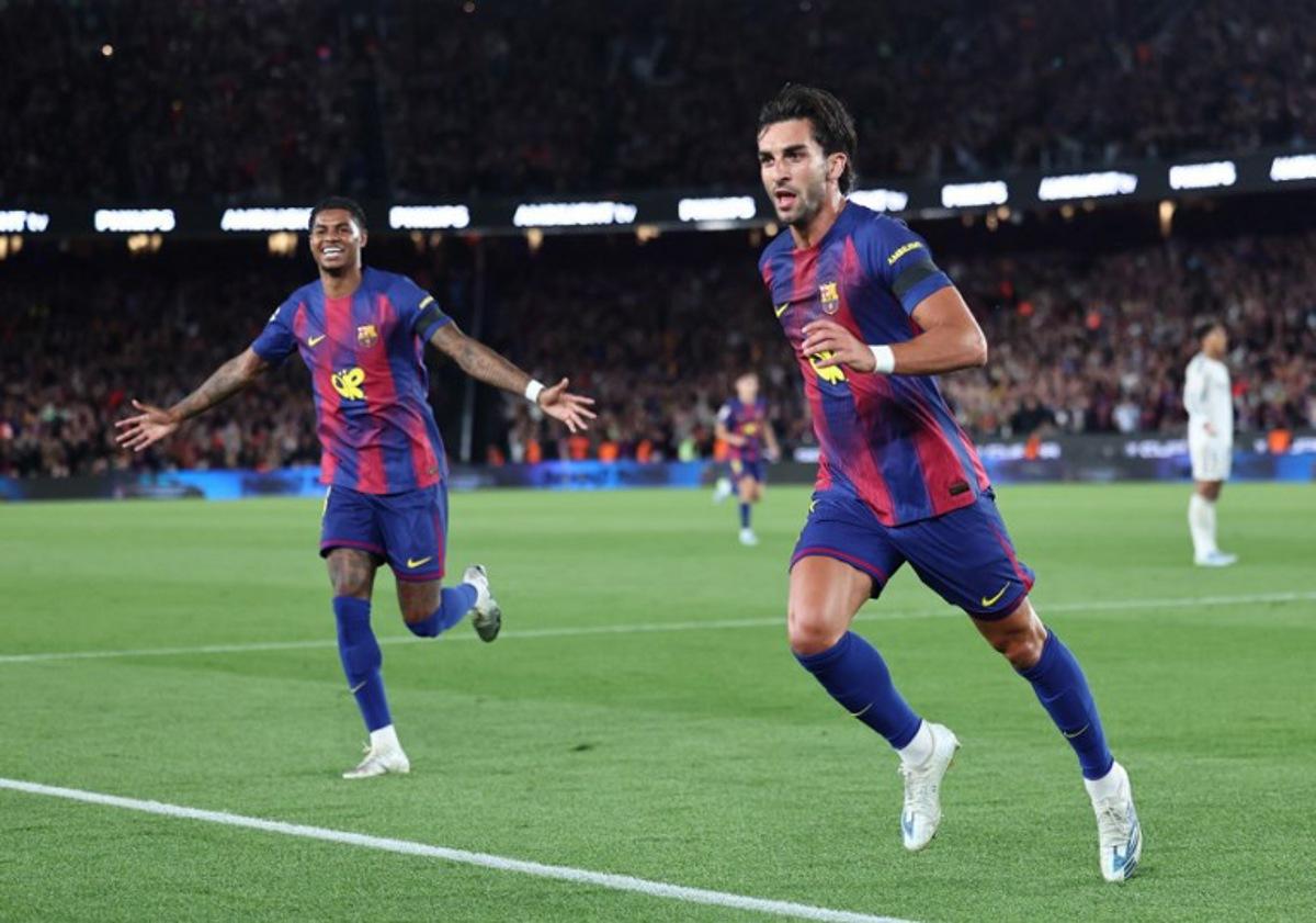 Barcelona's Spanish forward #07 Ferran Torres (R) celebrates scoring his team's second goal with Barcelona's English forward #14 Marcus Rashford during the Spanish league football match between FC Barcelona and Real Madrid CF at Camp Nou Stadium in Barcelona on May 10, 2026.  Josep LAGO / AFP