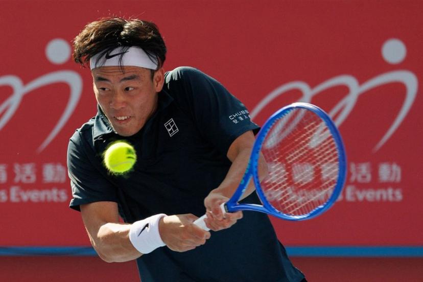 Hong Kong's Coleman Wong hits a return to Italy's Lorenzo Musetti during their men's singles quarter-final match at Hong Kong Tennis Open in Hong Kong on January 9, 2026.  May JAMES / AFP