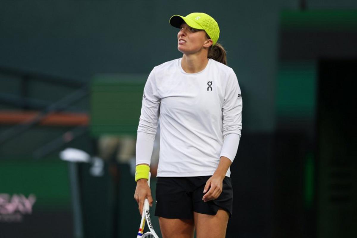 Poland's Iga Swiatek reacts while playing against Russia's Mirra Andreeva during their women's singles semi-final tennis match at the BNP Paribas Open at the Indian Wells Tennis Garden in Indian Wells, California, on March 14, 2025.  Patrick T. Fallon / AFP