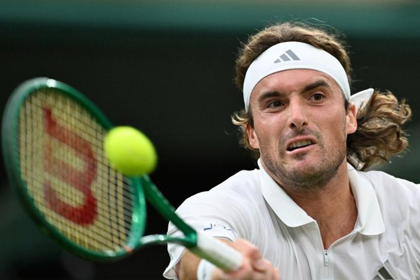 Greece's Stefanos Tsitsipas returns to Serbia's Novak Djokovic during their men's singles second round tennis match on the third day of the 2026 Wimbledon Championships at The All England Lawn Tennis and Croquet Club in Wimbledon, southwest London, on July 1, 2026.  Kirill KUDRYAVTSEV / AFP