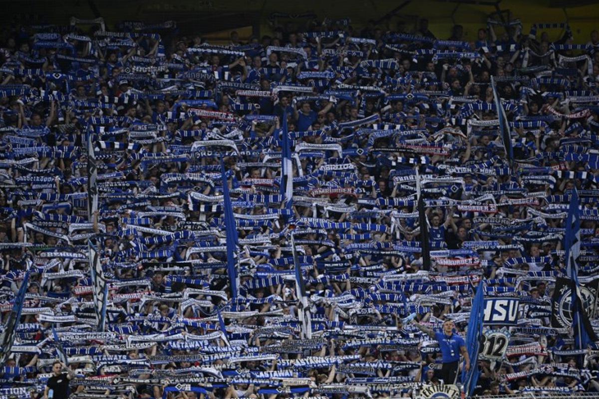 Hamburg SV fans cheer their team during the German first division Bundesliga football match between BVB Borussia Dortmund and Hamburg SV in Dortmund, western Germany on August 29, 2026.  INA FASSBENDER / AFP