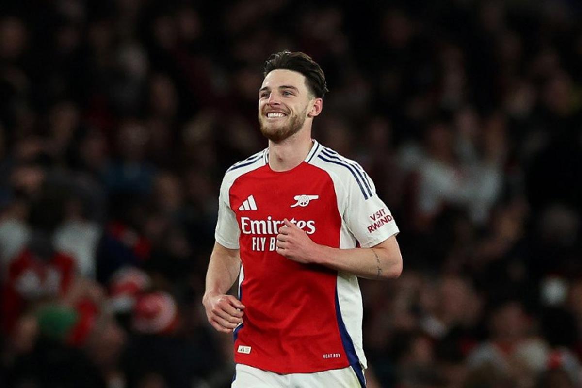 Arsenal's English midfielder #41 Declan Rice celebrates scoring the team's second goal during the UEFA Champions League Quarter final first leg football match between Arsenal and Real Madrid, at the Emirates Stadium, in London, on April 8, 2025.   Adrian Dennis / AFP