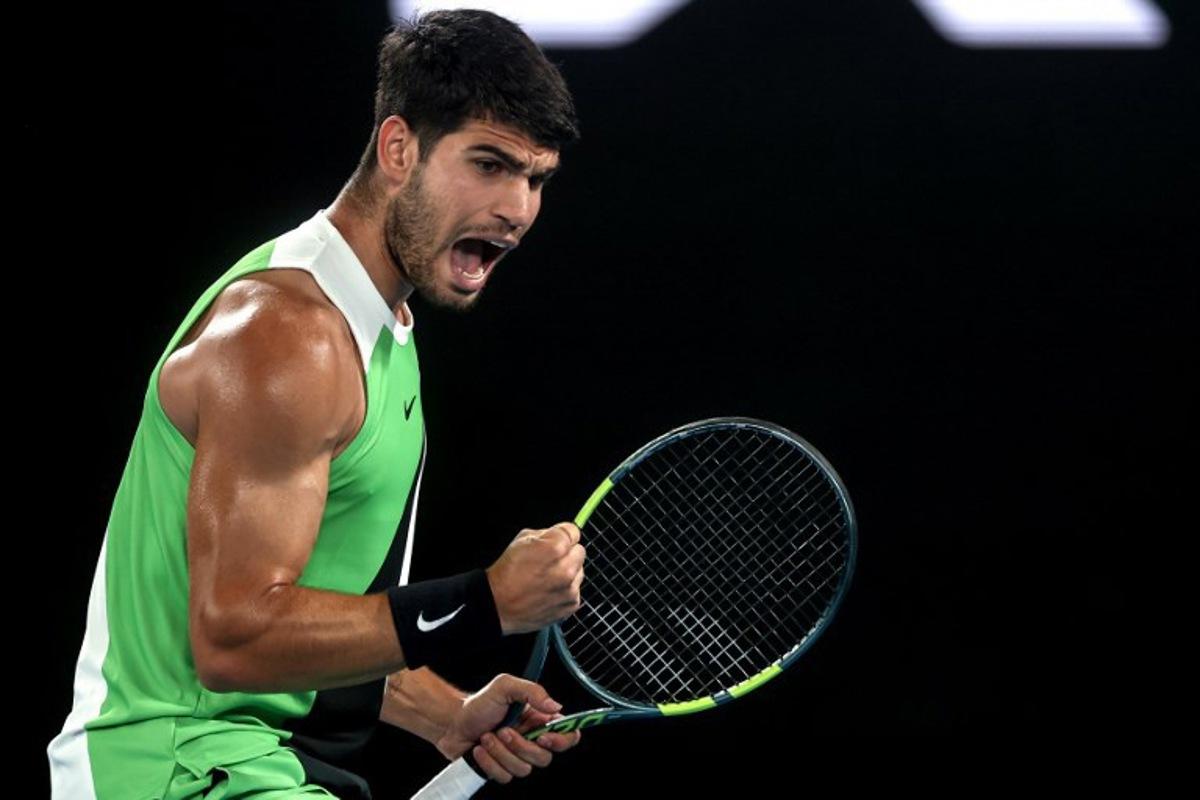 Spain's Carlos Alcaraz reacts after a point against Australia's Alex De Minaur during their men's singles quarter-final match on day ten of the Australian Open tennis tournament in Melbourne on January 27, 2026.  IZHAR KHAN / AFP