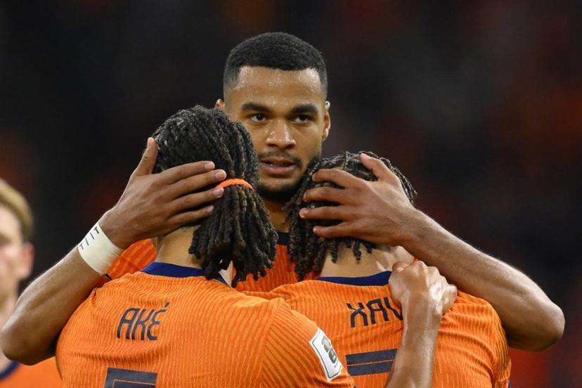 Netherlands' forward #11 Cody Gakpo (C) celebrates with teammates after scoring his team's fourth goalduring the FIFA World Cup 2026 Group G qualification football match between Netherlands and Finland, at the Johan Cruyff Arena in Amsterdam, on October 12, 2025.  JOHN THYS / AFP