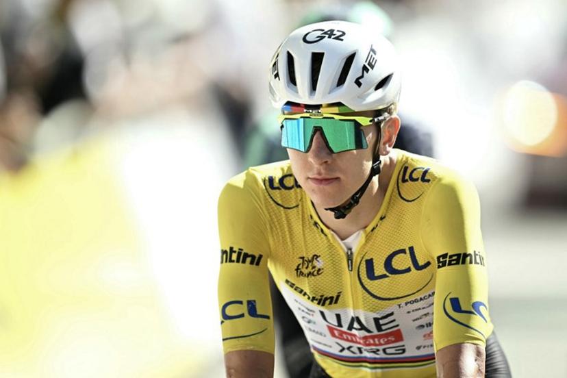 UAE Team Emirates - XRG's Slovenian rider Tadej Pogacar wearing the overall leader's yellow jersey cycles with the pack of riders (peloton) past the finish line of the 18th stage of the 113th edition of the Tour de France cycling race, 185,2 km between Voiron and Orcières-Merlette in the French Alps, on July 23, 2026.  Loic VENANCE / AFP