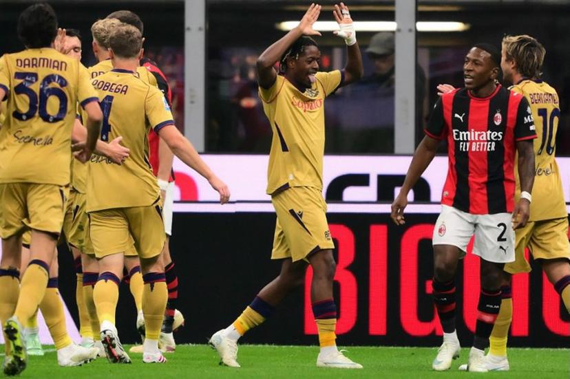 Bologna's Belgian forward #11 Samuel Mbangula (C) celebrates after scoring his team first goal during the Italian Serie A football match between AC Milan and Bologna at the San Siro stadium in Milan, northern Italy on October 28, 2026.  Marco Bertorello / AFP
