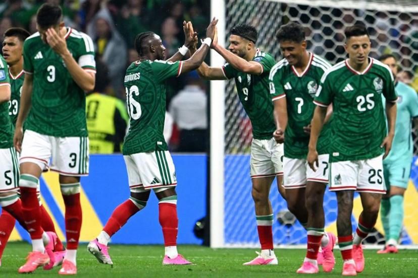 Mexico's forward #09 Raul Jimenez celebrates with teammate forward #16 Julian Quinones scoring his team's second goal during the 2026 World Cup round of 32 football match between Mexico and Ecuador at the Mexico City Stadium in Mexico City on June 30, 2026.   CARL DE SOUZA / AFP