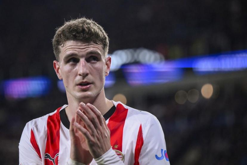 PSV Eindhoven's Dutch midfielder #20 Guus Til reacts during the UEFA Champions League, league phase day 6, football match between PSV Eindhoven (NED) and Atletico Madrid (ESP), at the Philips Stadion, in Eindhoven, south of The Netherlands, on December 9, 2025.  JOHN THYS / AFP