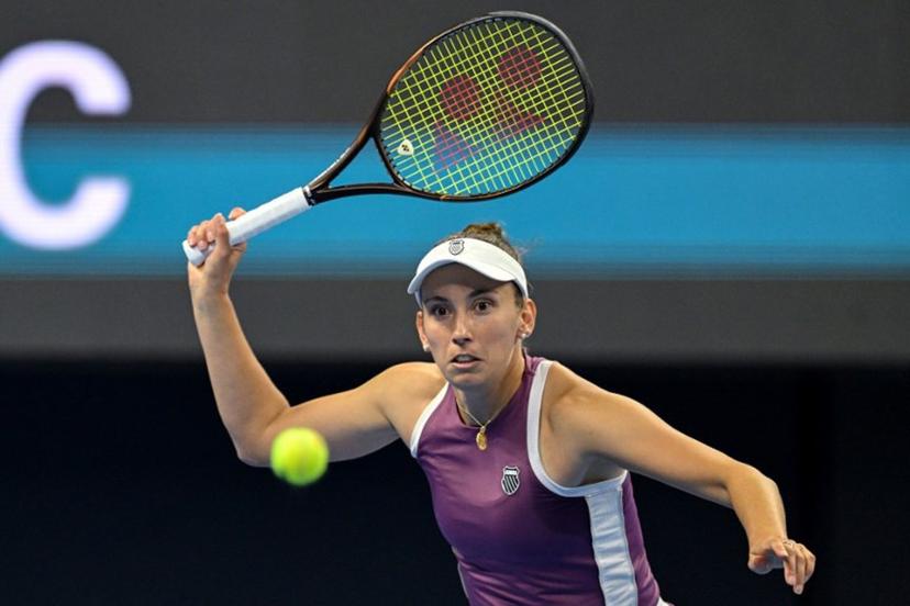 Belgium's Elise Mertens hits a return to Poland's Iga Swiatek during their women's singles quarter-final at the China Open tennis tournament in Beijing on October 9, 2026.  GREG BAKER / AFP
