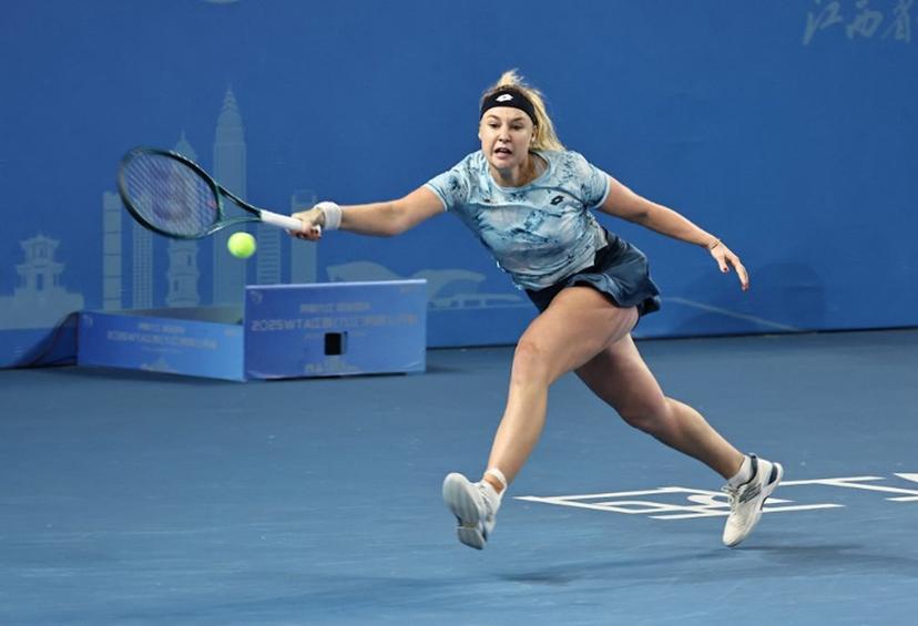 Russia's Anna Blinkova hits a return to USA's Alycia Parks during their women's singles quarterfinal match at the Jiangxi Open tennis tournament in Jiujiang, central China's Jiangxi province on October 31, 2025.  STR / AFP