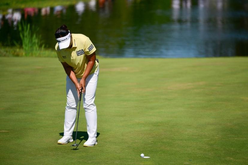 South Korea's Haeran Ryu plays her final shot to win the Amundi Evian Championship at Evian Resort Golf Club, in Evian-Les-Bains, centre eastern France, on July 12, 2026.  OLIVIER CHASSIGNOLE / AFP