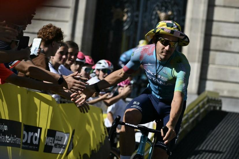 XDS Astana Team's Italian rider Davide Ballerini cycle through Lille's city center during the official teams presentation days prior to the start of the 112th edition of the Tour de France cycling race, in Lille, northern France, on July 3, 2025.  Marco BERTORELLO / AFP
