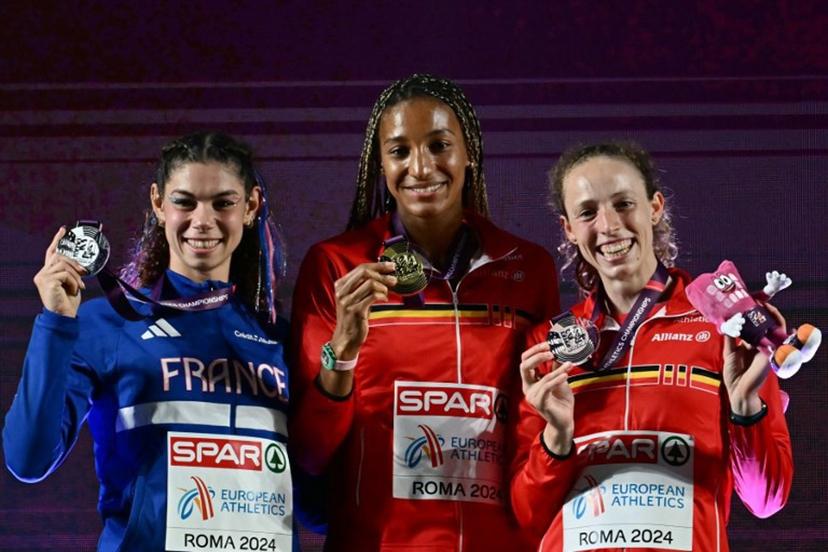 Gold medallist Belgium's athlete Nafissatou Thiam (C) celebrates with silver medallist France's Auriana Lazraq-Khlass (L) and bronze medallist Belgium's Noor Vidts during the medal ceremony for the women's heptathlon during the European Athletics Championships at the Olympic stadium in Rome on June 8, 2024.  Filippo MONTEFORTE / AFP