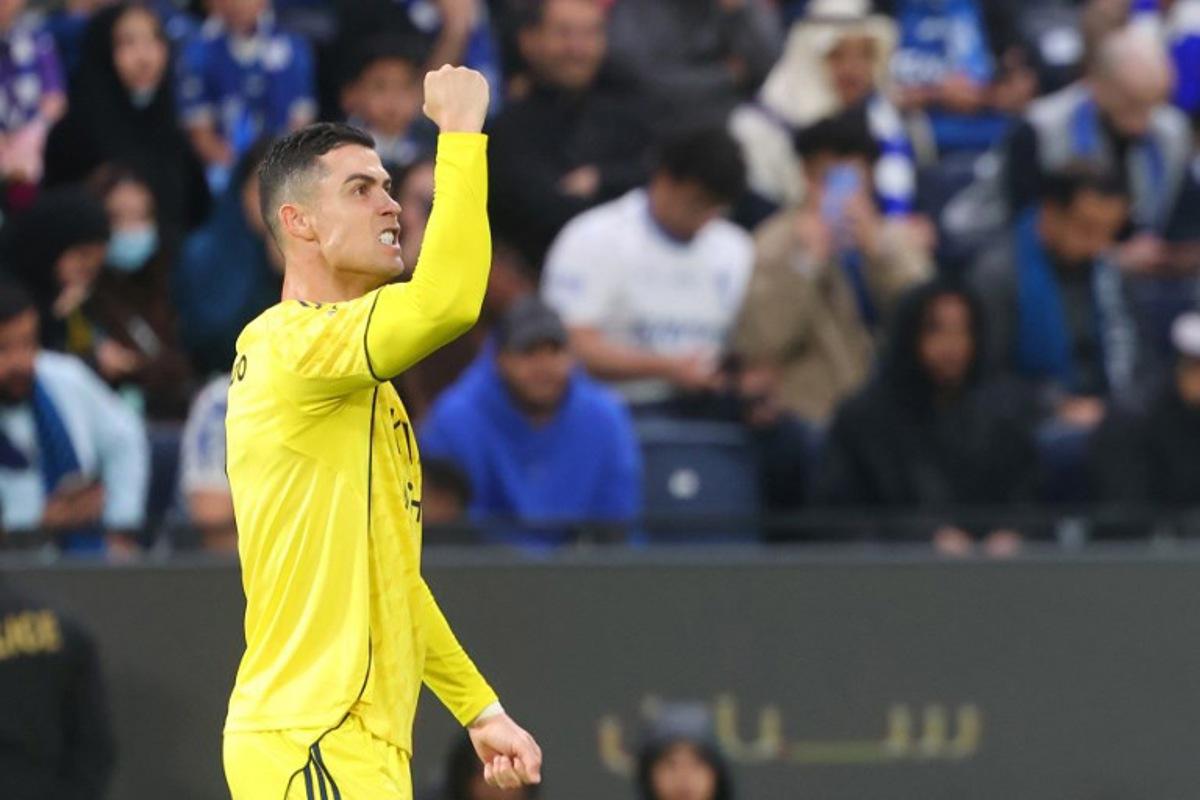 Nassr's Portuguese forward #07 Cristiano Ronaldo celebrates after scoring a goal during the Saudi Pro League football match between Al-Hilal and Al-Nassr at Kingdom Arena stadium in Riyadh on January 12, 2026.  Fayez Nureldine / AFP