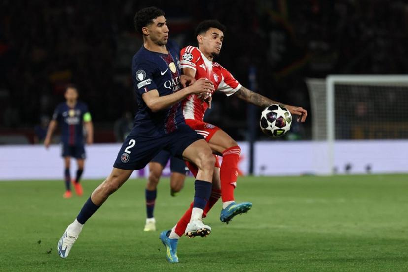 Paris Saint-Germain's Moroccan defender #02 Achraf Hakimi fights for the ball with Bayern Munich's Colombian forward #14 Luis Diaz during the UEFA Champions League semi-final first leg football match between Paris Saint-Germain (PSG) and Bayern Munich at the Parc des Princes in Paris on April 28, 2026.  Anne-Christine POUJOULAT / AFP