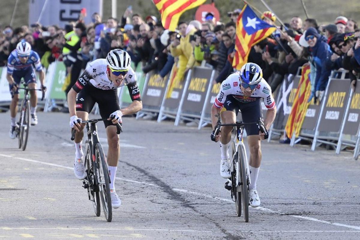 Team UAE's Juan Ayuso (C) and Team Bora's Primoz Roglic (R) sprint to cross the finish line in first and second place respectively followed by Team Soudal-Quick Step's Mikel Landa (L) during the 3rd stage of the 2025 Volta a Catalunya cycling tour of Catalonia, a 178,3 km race between Viladecans and La Molina, on March 26, 2025.  Josep LAGO / AFP