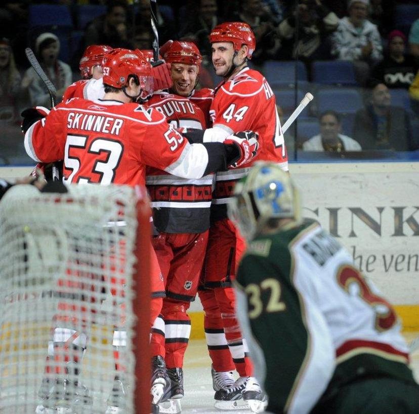 Hurricanes' Jeff Skinner (L), Jay Harrison (R) and Jussi Jokinen (L) celebrate Tuomo Ruutu's (C) game-tying 1-1 goal  during the ice hockey NHL regular season game Carolina Hurricanes vs Minnesota Wild  in Helsinki on October 8, 2010. AFP PHOTO LEHTIKUVA / Heikki Saukkomaa *** FINLAND OUT ***  LEHTIKUVA / AFP FINLAND OUT.

