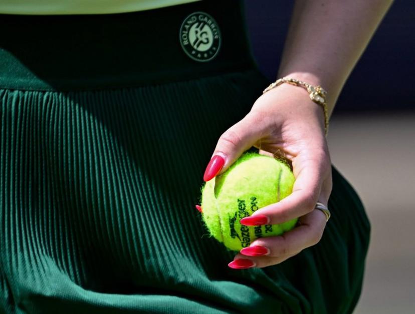 Germany's Eva Lys serves the ball to Poland's Magdalena Frech during the women's singles round of 16 match at the WTA500 Berlin Tennis Open tournament in Berlin on June 16, 2026.  Tobias SCHWARZ / AFP