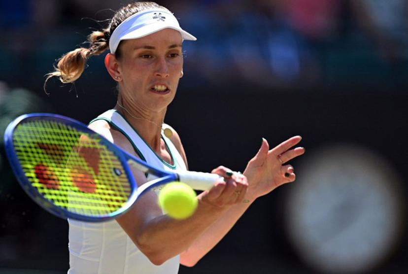 Belgium's Elise Mertens returns to Czech Republic's Linda Noskova during their women's singles quarter-final tennis match on the tenth day of the 2026 Wimbledon Championships at The All England Lawn Tennis and Croquet Club in Wimbledon, southwest London, on July 8, 2026.  Kirill KUDRYAVTSEV / AFP
