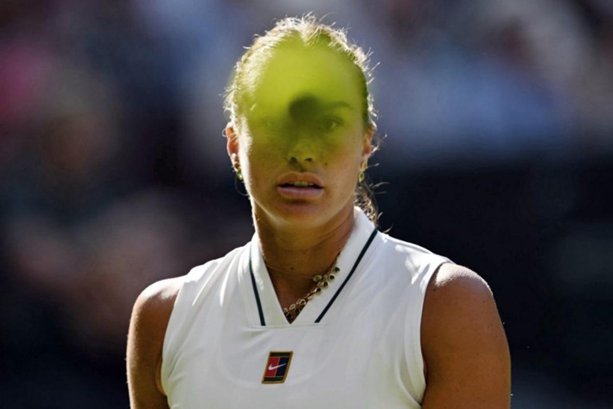 Belarus's Aryna Sabalenka looks at a ball as she plays against Latvia's Jelena Ostapenko during their women's singles third round tennis match on the fifth day of the 2026 Wimbledon Championships at The All England Lawn Tennis and Croquet Club in Wimbledon, southwest London, on July 3, 2026.  Glyn KIRK / AFP