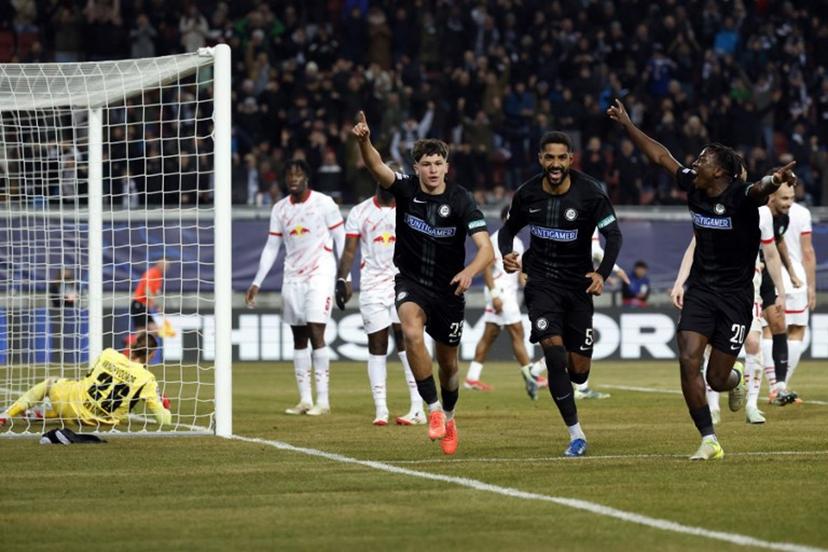 Sturm Graz's Slovenian defender #23 Arjan Malic (2L) celebrates with teammates Sturm Graz's Swiss defender #05 Gregory Wuethrich (2R) and Sturm Graz's Norwegian forward #20 Seedy Jatta after he scored his team's first goal past Leipzig's Belgian goalkeeper #26 Maarten Vandevoordt during the UEFA Champions League football match between SK Sturm Graz and RB Leipzig in Klagenfurt, Austria on January 29, 2025.  ERWIN SCHERIAU / APA / AFP