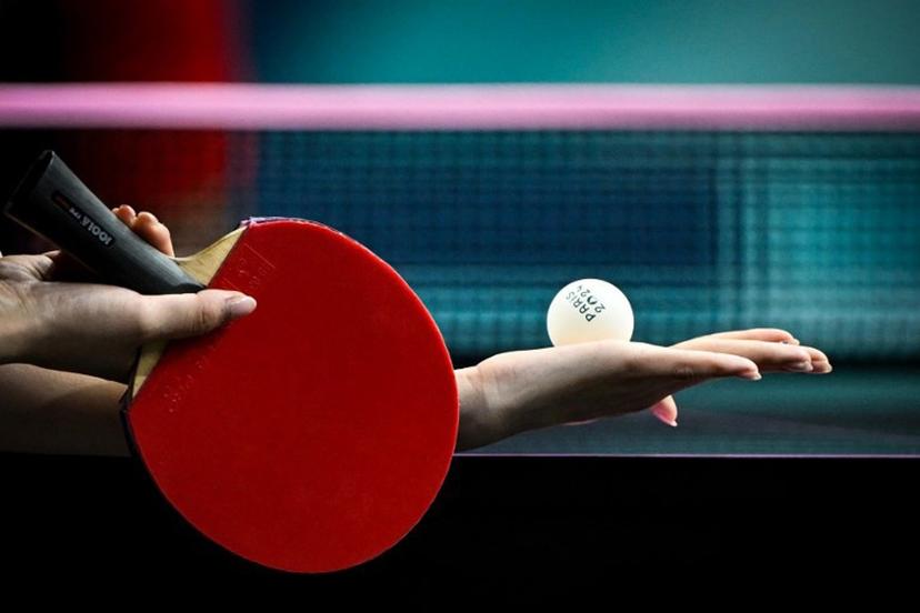 An athlete holds the official tennis table ball as she prepares to serve during the women's table tennis singles round of 64 at the Paris 2024 Olympic Games at the South Paris Arena in Paris on July 27, 2024.  WANG Zhao / AFP