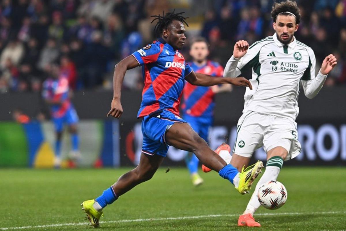 Viktoria Plzen's Ghanaian forward #80 Prince Kwabena Adu and Panathinaikos' Algerian defender #05 Ahmed Touba vie for the ball during the UEFA Europa League knockout round playoff second leg football match FC Viktoria Plzen v Panathinaikos in Plzen, Czech Republic, on February 26, 2026.   Michal Cizek / AFP