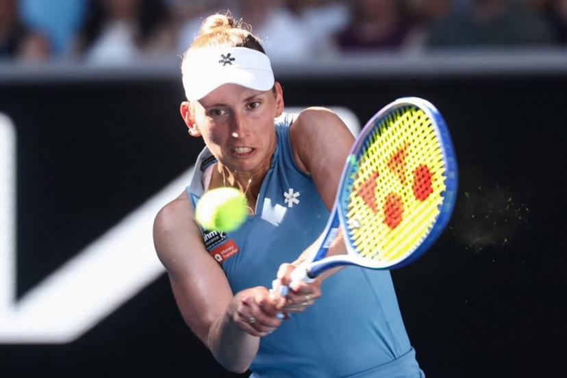 Belgium's Elise Mertens hits a return to Kazakhstan's Elena Rybakina during their women's singles match on day nine of the Australian Open tennis tournament in Melbourne on January 26, 2026.  IZHAR KHAN / AFP