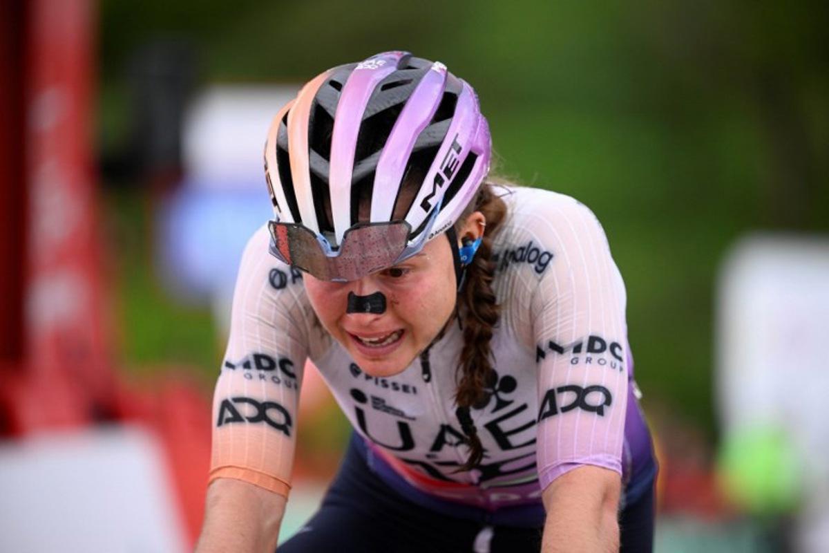 Team UAE ADQ's Spanish rider Paula Blasi Cairol crosses in second position the finish line of the 6th stage of the 2026 La Vuelta Femenina cycling tour of Spain, a 106.5 km race between Gijon and Les Praeres, on May 8, 2026.   Miguel RIOPA / AFP