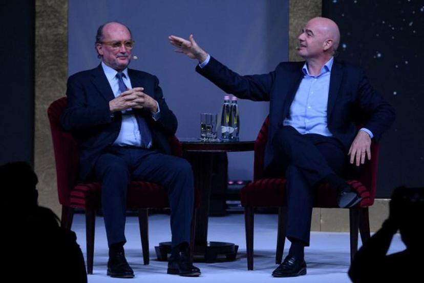 FIFA President Gianni Infantino talks with the President of the Association of International Sports Press (AIPS) Giovanni Merlo during a public debate with AIPS members as part of the association's annual congress on February 3, 2020 in Budapest, Hungary.  Attila KISBENEDEK / AFP