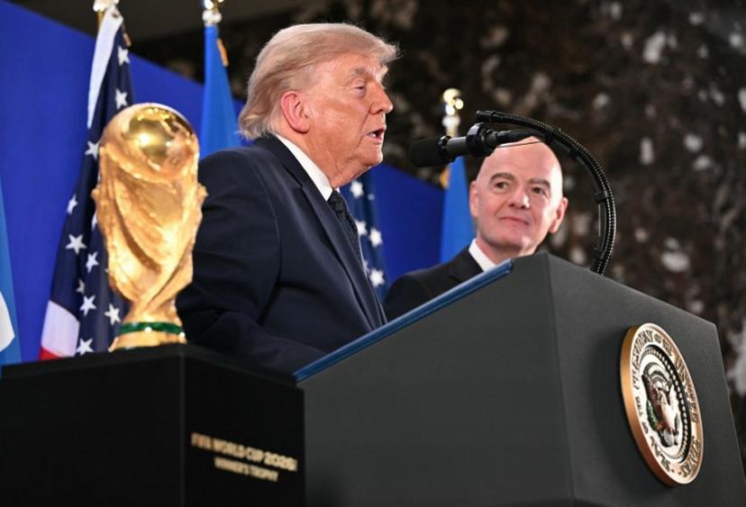 The FIFA World Cup Trophy is displayed as US President Donald Trump speaks next to FIFA President Gianni Infantino during a FIFA reception at Trump Tower in New York on July 17, 2026. President Trump will attend the 2026 World Cup Final between Spain and Argentina. Mandel NGAN / AFP