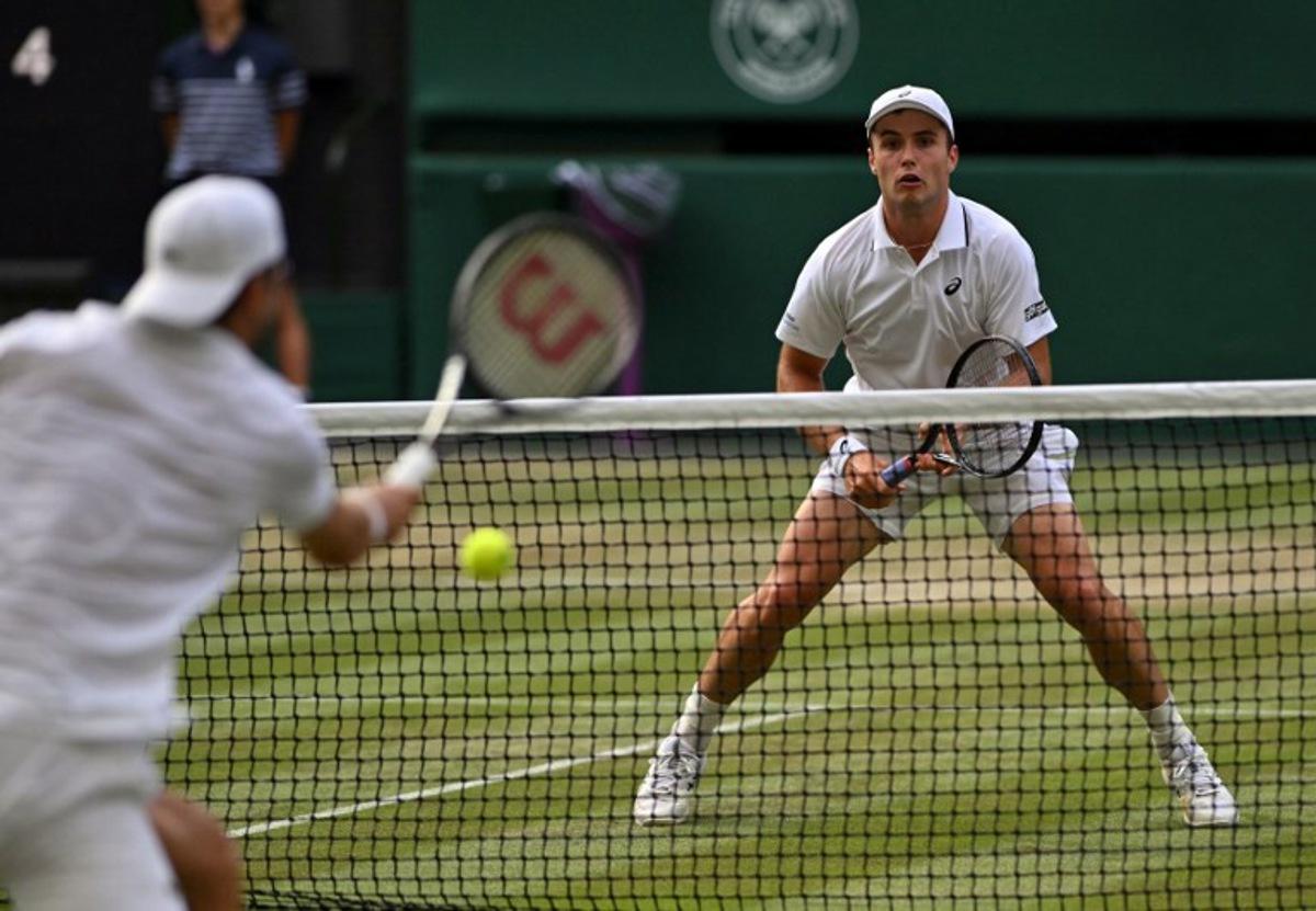 Britain's Arthur Fery (R) prepares to return to Bulgaria's Grigor Dimitrov during their men's singles round of 16 tennis match on the eighth day of the 2026 Wimbledon Championships at The All England Lawn Tennis and Croquet Club in Wimbledon, southwest London, on July 6, 2026.  Glyn KIRK / AFP