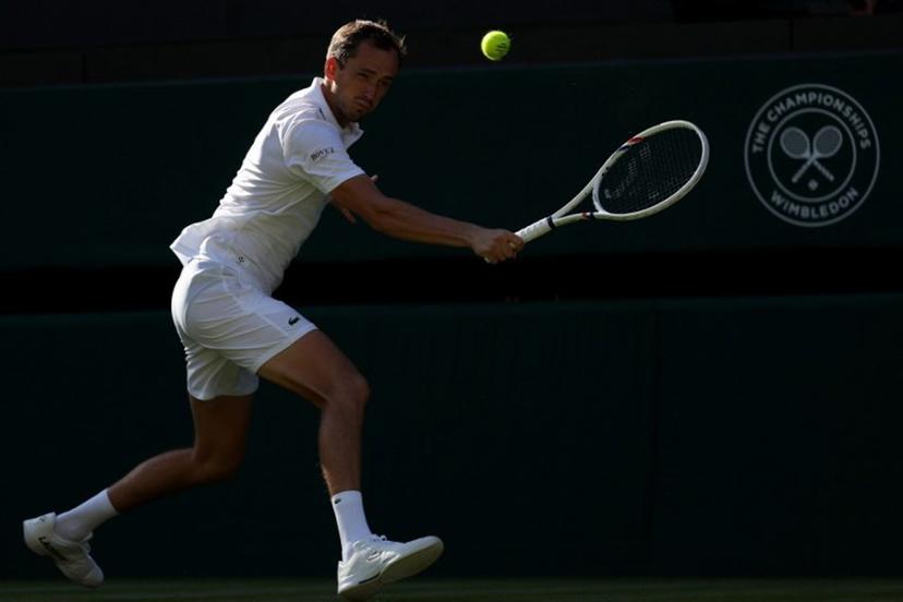 Russia's Daniil Medvedev returns to Croatia's Marin Cilic during their men's singles first round tennis match on the first day of the 2026 Wimbledon Championships at The All England Lawn Tennis and Croquet Club in Wimbledon, southwest London, on June 29, 2026.  Adrian Dennis / AFP
