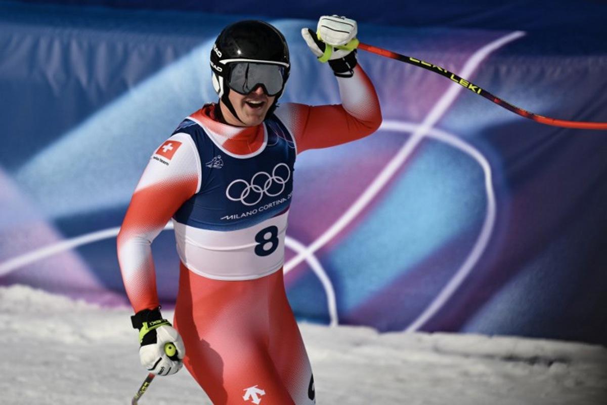 Switzerland's Franjo von Allmen reacts in the finish area after competing in the men's downhill alpine skiing event during the Milano Cortina 2026 Winter Olympic Games at the Stelvio Ski Centre in Bormio (Valtellina) on February 7, 2026.  Jeff PACHOUD / AFP