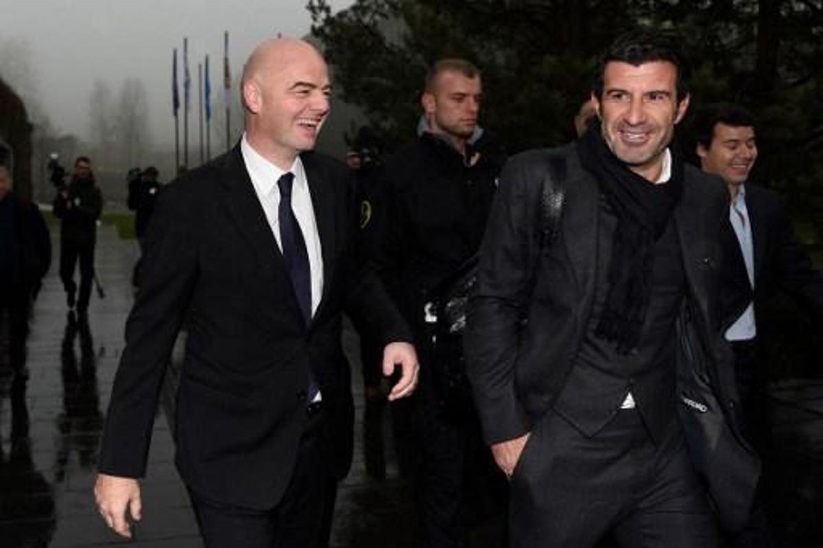 Newly-elected FIFA president Gianni Infantino (L) and former Portuguese international player Luis Figo (R) arrive at the FIFA headquarters on February 29, 2016 in Zurich.  Gianni Infantino insisted on February 28, 2016 that FIFA's reform package would close the door on a chapter of pain at world football's governing body and usher in an era of joy. / AFP / VALERIANO DI DOMENICO