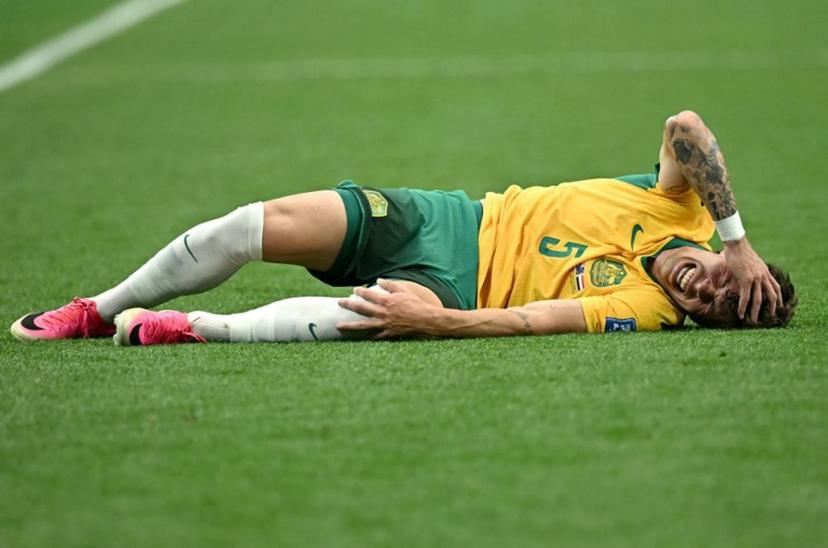 Australia's defender #05 Jordan Bos reacts on the ground during the 2026 World Cup round of 32 football match between Australia and Egypt at the Dallas Stadium in Arlington on July 3, 2026.   Paul ELLIS / AFP