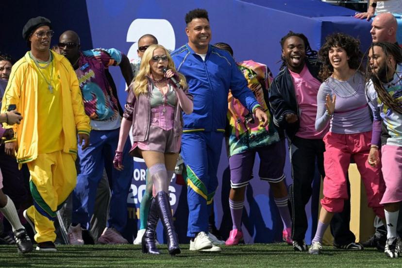 US singer Madonna (C) performs with Brazilian footballer Ronaldinho (L) and Brazilian former footballer Ronaldo during the halftime show of the 2026 World Cup football tournament final match between Spain and Argentina at the New York/New Jersey Stadium in East Rutherford on July 19, 2026.   JUAN MABROMATA / AFP