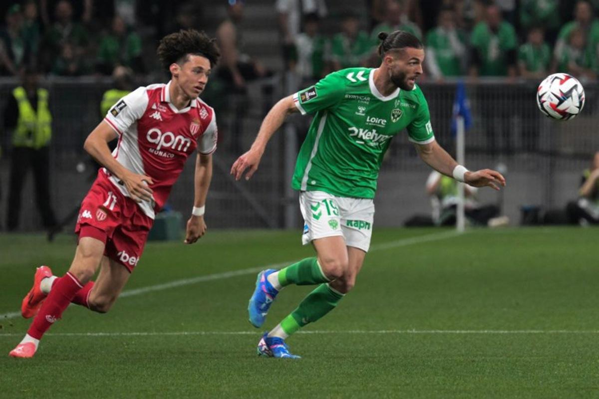 Monaco's French midfielder #11 Maghnes Akliouche (L) fights the ball with Saint Etienne's French defender #19 Leo Petrot (R) during the French L1 football match between AS Saint-Etienne and AS Monaco at the Geoffroy Guichard Stadium in Saint-Etienne, central-eastern France, on May 3, 2025.  JEAN-PHILIPPE KSIAZEK / AFP