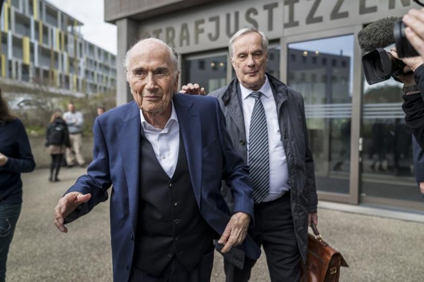 Former FIFA president Sepp Blatter (L) leaves with his lawyer Lorenz Erni (R) the courthouse after the verdict of an appeal by Swiss Attorney General's office against former UEFA and FIFA presidents over a suspected fraudulent payment, in Muttenz near Basel, on March 25, 2025. Former FIFA president Sepp Blatter and ex-UEFA chief Michel Platini were acquitted again  on March 25, 2025 on appeal by a Swiss court in a long-running corruption case. Fabrice COFFRINI / AFP