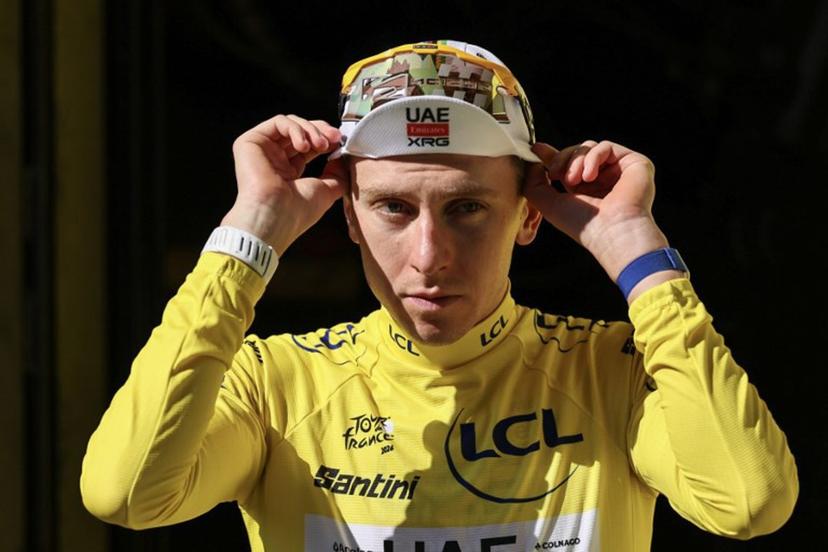 UAE Team Emirates - XRG's Slovenian rider Tadej Pogacar celebrates on the podium with the overall leader's yellow jersey after the 17th stage of the 113th edition of the Tour de France cycling race, 174,7 km between Chambéry and Voiron in the French Alps, on July 22, 2026.  Anne-Christine POUJOULAT / AFP
