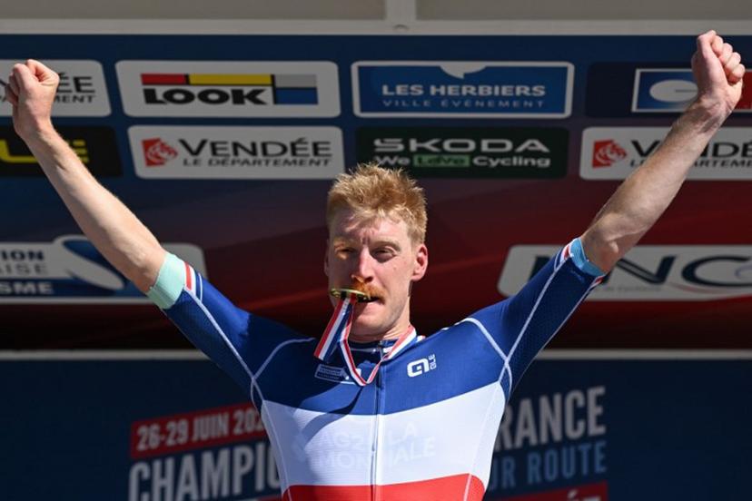 Decathlon-AG2R La Mondiale's French rider Dorian Godon poses with his medal after winning the men's Elite race of the French National Road Cycling championships, in Les Herbiers, western France, on June 29, 2025.  Sebastien Salom-Gomis / AFP