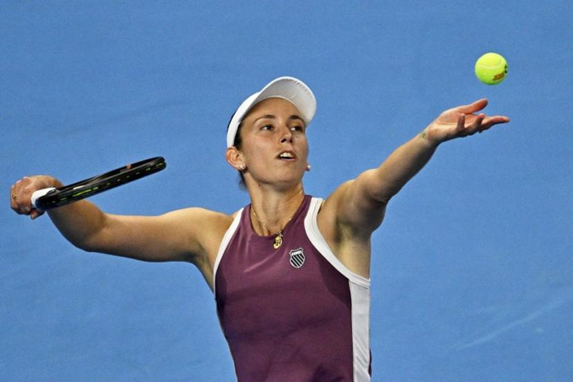 Belgium's Elise Mertens serves to China's Zheng Qinwen during their women's singles semi-final at the China Open tennis tournament in Beijing on October 10, 2026.  Pedro PARDO / AFP