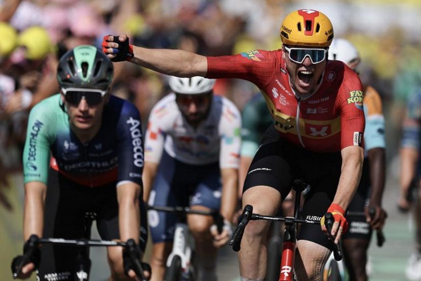 Uno-X Mobility team's Norwegian rider Soren Waerenskjold cycles to the finish line to win the 11th stage of the 113th edition of the Tour de France cycling race, 161,3 km between Vichy and Nevers in central France, on July 15, 2026.  Anne-Christine POUJOULAT / AFP