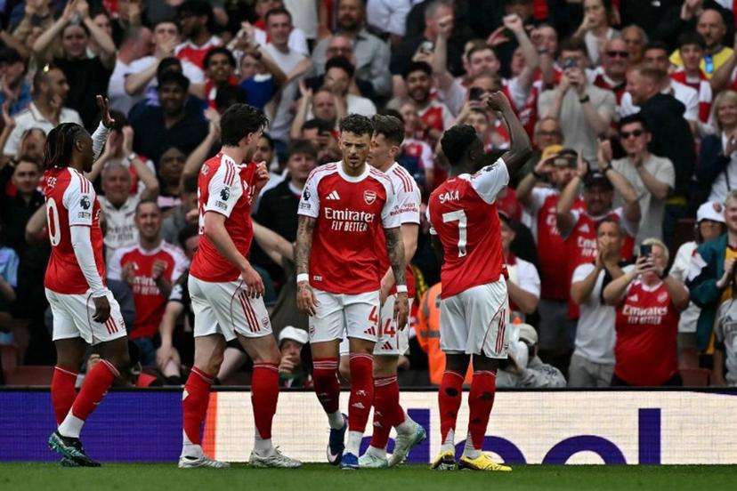 Arsenal's English midfielder #07 Bukayo Saka (R) celebrates scoring the team's second goal during the English Premier League football match between Arsenal and Fulham at the Emirates Stadium in London on May 2, 2026.   Ben STANSALL / AFP