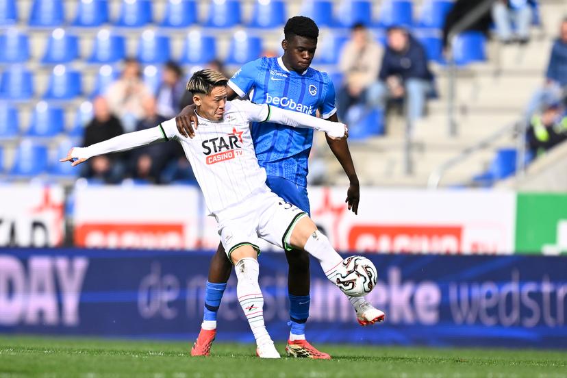 OHL's Takahiro Akimoto and Genk's Josue Kongolo fight for the ball during a soccer match between KRC Genk and Oud-Heverlee Leuven, Sunday 12 April 2026 in Heverlee, on the second day of the Europe Play-offs (PO 2) of the 2025-2026 'Jupiler Pro League' first division of the Belgian championship. BELGA PHOTO JOHAN EYCKENS